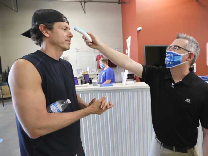 Gym staff and clients are undergoing temperature checks as they enter some facilities.