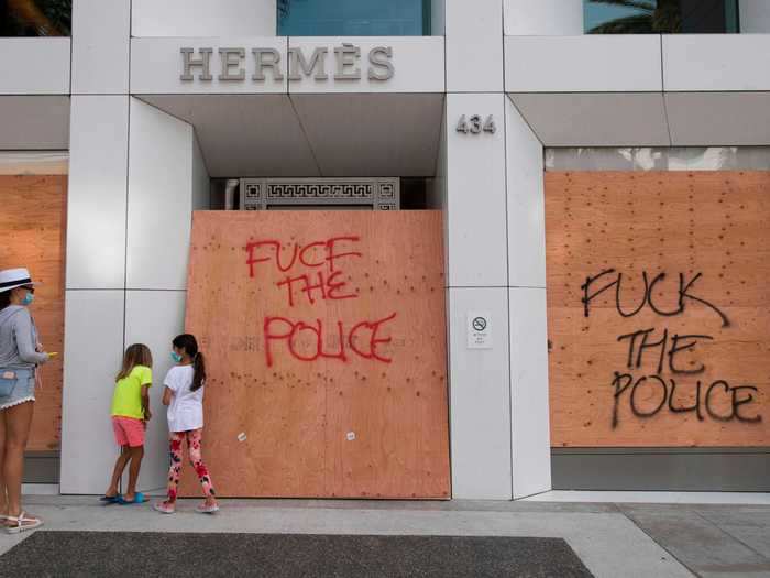 Many luxury stores were already boarded up as retailers throughout the world shut because of the coronavirus pandemic.