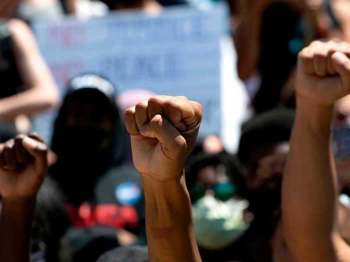 In peaceful demonstrations, protesters have raised their fists in the air as a sign of solidarity.