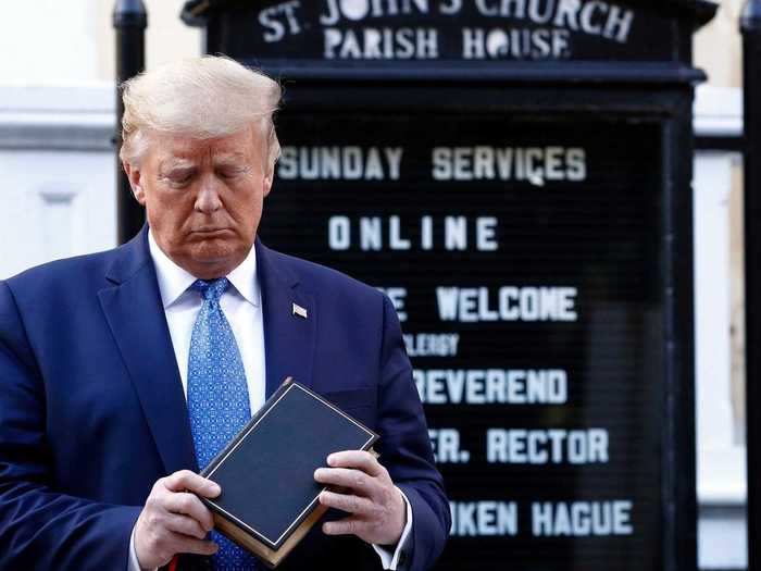 Shortly after protesters were cleared out, Trump posed for a photo at St. John