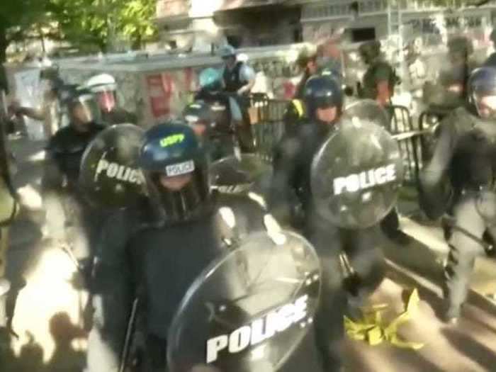 Police began using flash bangs and tear gas to clear protesters from Lafayette Square.