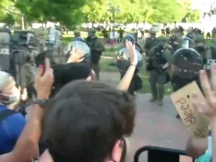 Protesters were gathered behind barriers set up in Lafayette Square.