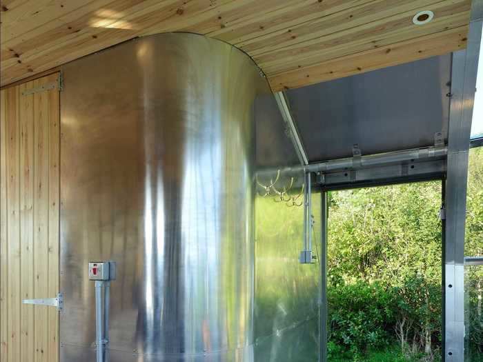 For the shower, the wood stove can be outfitted to provide hot water, or solar panels or a generator can be used.