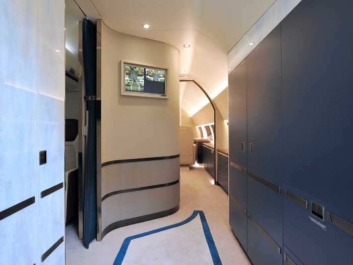 Stepping onboard the aircraft, a small hallway leads to the main passenger areas.