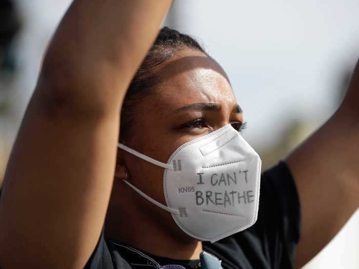 A protester turned an N95 mask into a protest sign in Santa Monica, California.