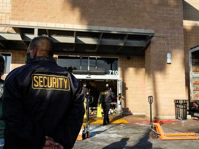 Just a few blocks north of Les Miller, the Vons supermarket was taped off with caution tape as store workers stood outside. Several security guards looked on.