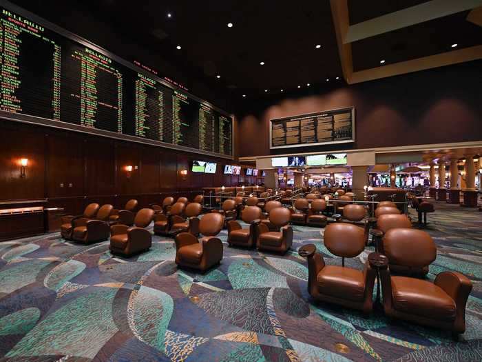 Seats in the sportsbook are spaced apart for social distancing.
