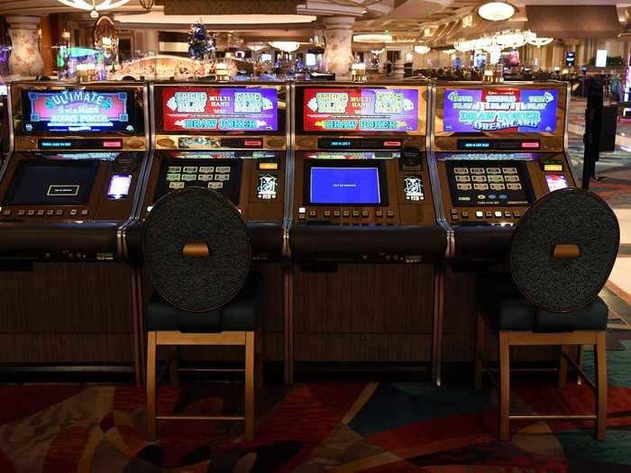 On the casino floor, machines are set up so that every other seat is out of service.