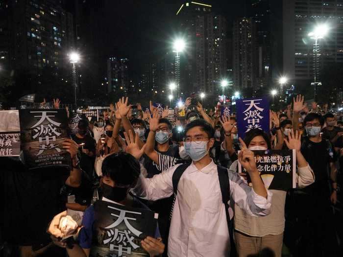 Nonetheless, Hong Kongers came out in numbers to fight against the new laws. In this photo, protesters are seen doing a hand gesture that means "Five demands, not one less" that was established last year during widespread pro-democracy protests.