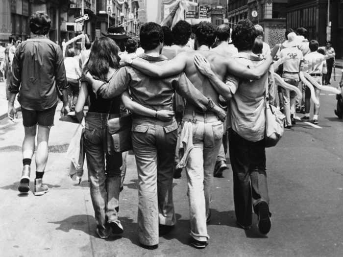 That same year, members of the LGBTQ community embraced each other along the parade route in New York.