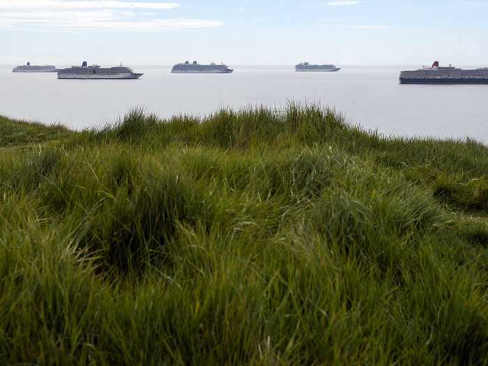 From left to right, they are: the Queen Mary 2, Aurora, Arcadia, Britannia, Azura, and the Queen Victoria.