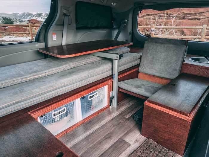 The flooring in the minivan has also been upgraded to vinyl, a common choice in many campers.