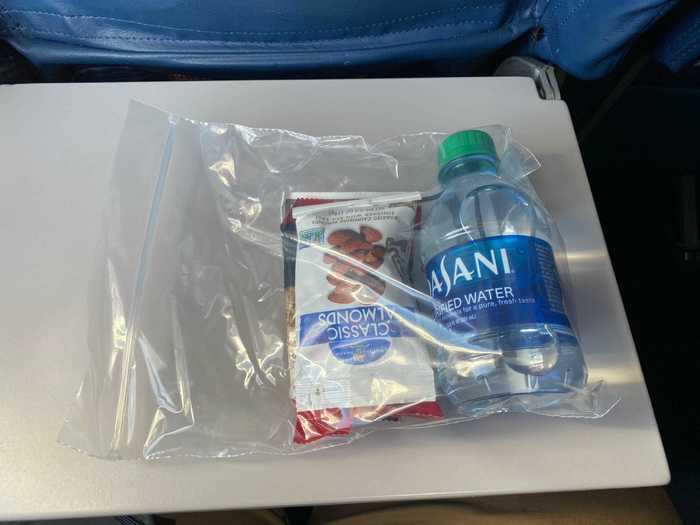 After take-off, the normal snack and beverage service was replaced by the flight attendants distributing plastic bags filled with some essentials.