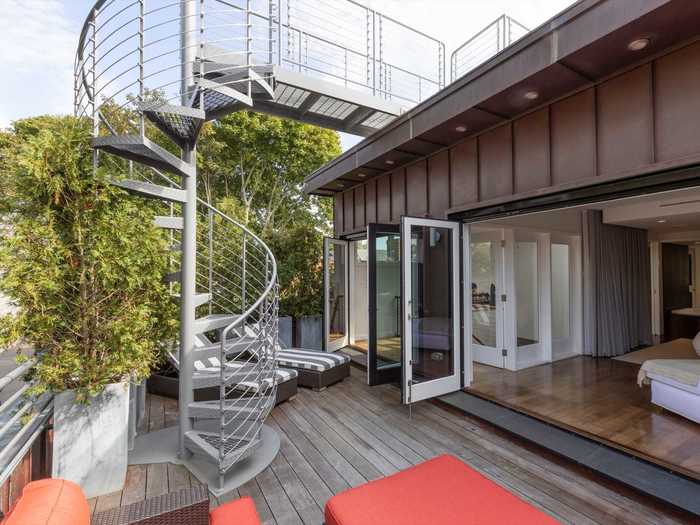 From the deck, a spiral staircase leads to a rooftop viewing platform ...