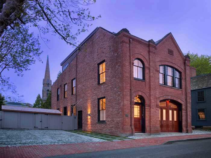 A three-story home built in a 19th-century Rhode Island fire station is on the market for $3.5 million, $1.2 million under its 2019 asking price.