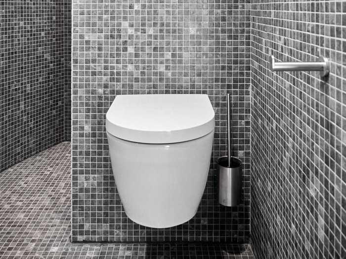 The tiled bathroom makes efficient use of space.