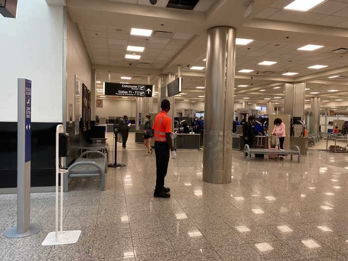 Delta employees were waiting after the checkpoint to offer passengers of all airlines a squirt of hand sanitizer. The airport