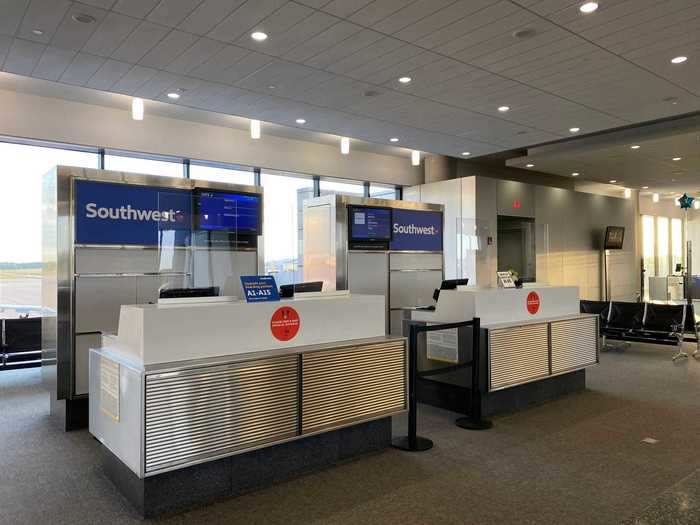 While the airport was focused on signage and strategically placed hand sanitizer dispensers, each airline had its own style of social distancing at their gates.