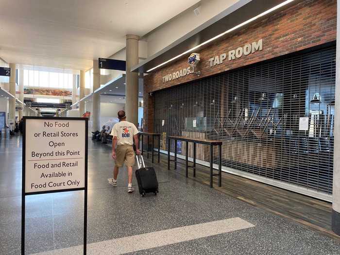 All the businesses on the way to the gate that were not located in the base of the terminal sat closed, unable to serve passengers.