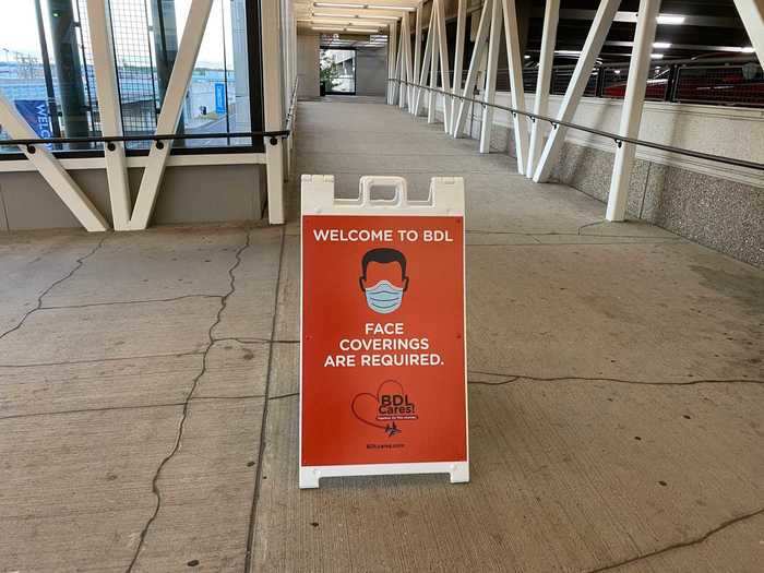 As soon as I parked my car and started walking through the terminal garage, I was greeted with this reminder to wear a face-covering while in the airport terminal. It wouldn