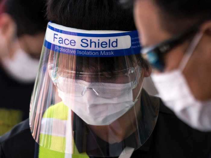 Some employees may be wearing face shields, like the one pictured below at Legoland in Japan.