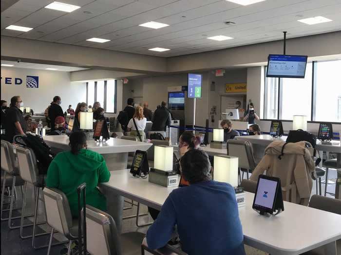 The gate agents, wearing masks and face shields, had passengers stand six feet apart as we boarded. Rather than follow the boarding group numbers on our tickets, they filed us onto the plane five rows at a time, starting from the back of the plane forward.