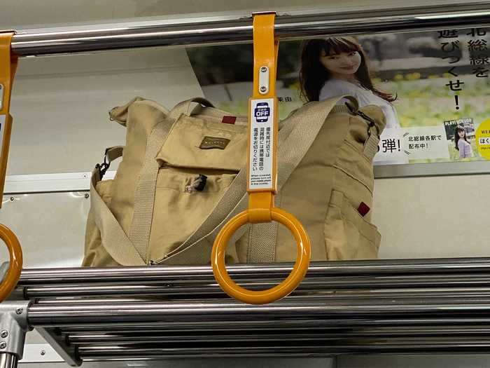 There are storage shelves above the seats for your bags.