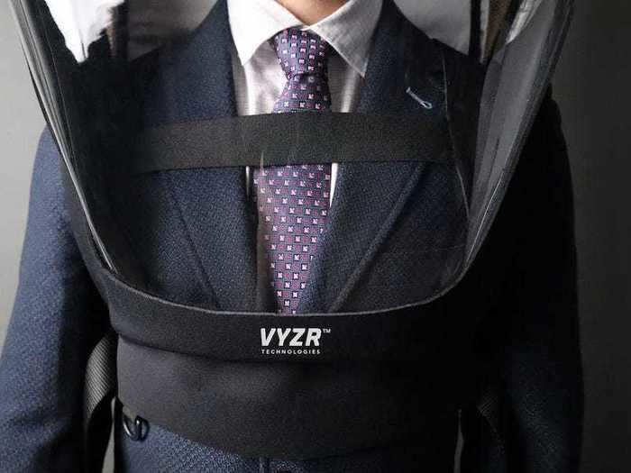 It has hooks for attaching hand sanitizer, and a USB port to charge the suit while wearing it.