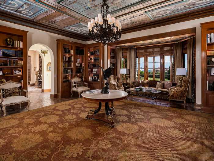 The sumptuous style carries into the library, which is located between the dining room and grand salon on the main level.