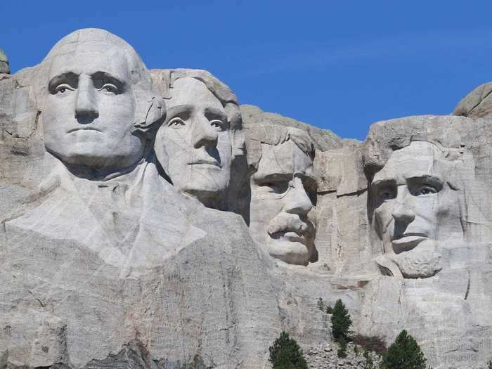 Mount Rushmore was designed by a sculptor who allegedly had ties to the Ku Klux Klan, and it was built on seized land.