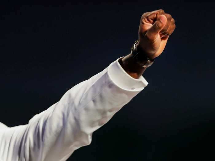 Family members and friends raised their fists as a symbol of solidarity and mourning.