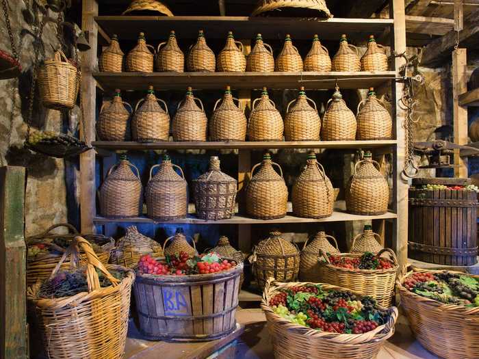 Inside the wine cellar, visitors can find traditional artifacts like these woven wine jugs.
