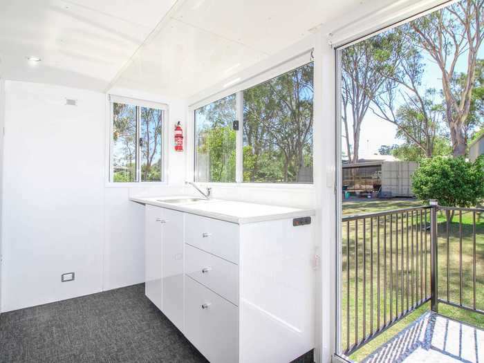 The deck sits behind clear sliding doors.