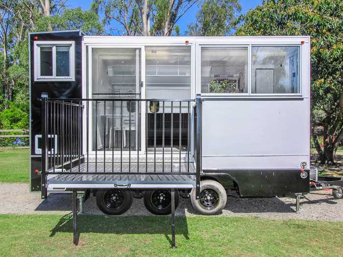 For outdoor lounging, The Tiny House Guys included an extended side deck that comes with detachable hand rails.