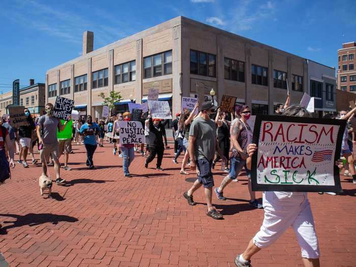 The protesters marched through the downtown area to city hall.