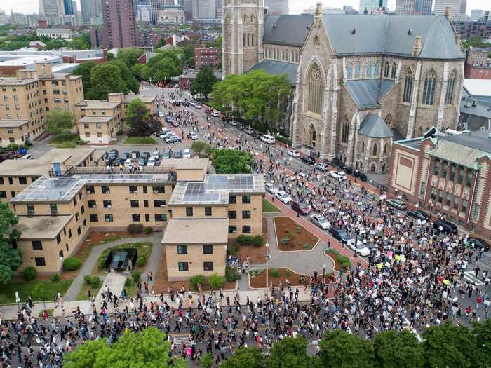 This aerial view of Boston, Massachusetts, shows thousands of protesters marching throughout the city.