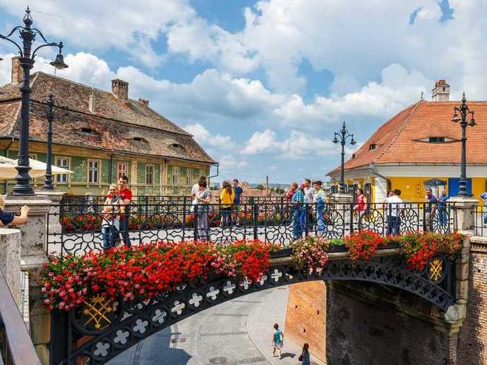 Once a wealthy Germanic walled citadel, Sibiu, Romania, is still home to walls from the 12th century, and its former grandeur shines through at every turn.