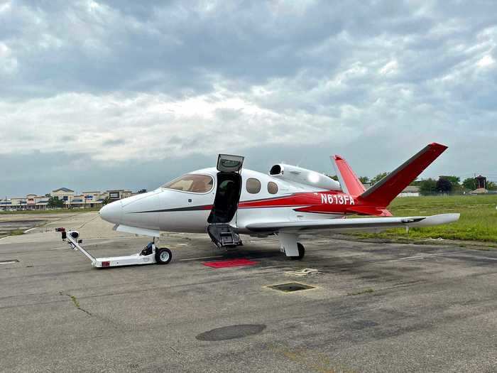 The tiny jet just barely stands out amid the school