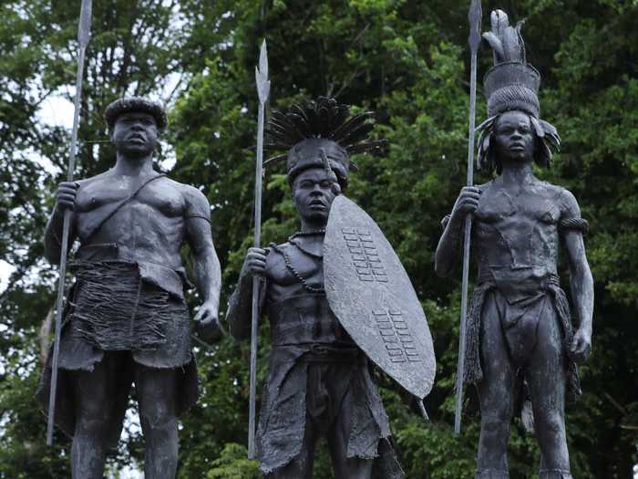 Across Belgium, statues of Belgian King Leopold II — one of the most notoriously brutal colonizers of Africa — have been torn down and defaced. Here, a statue of the king is seen covered in red paint in the garden of the African Museum.