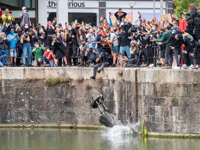 Afterwards, the protesters carried the statue to a nearby river and threw it into the water.