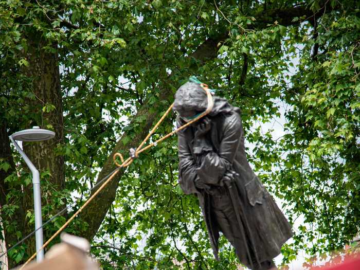 In Bristol, Britain, protesters used a rope to grab hold of the statue of slave trader Edward Colston in order to tear it down.