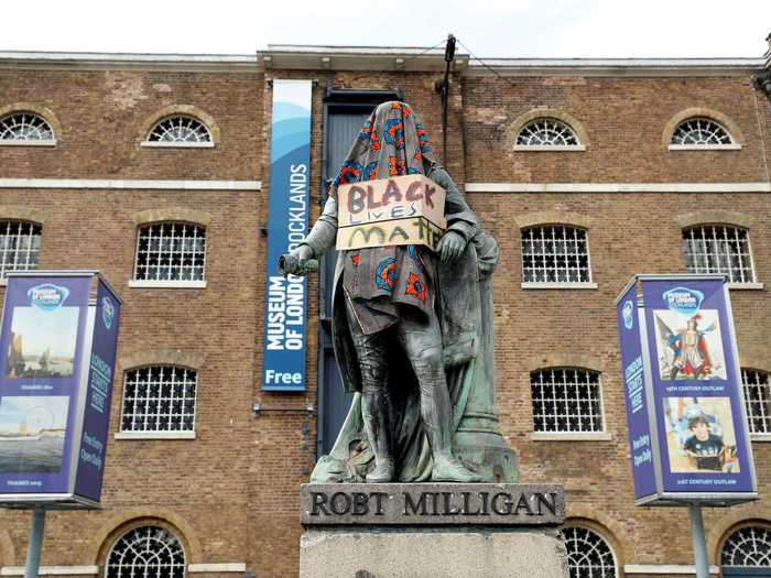 Outside of the Museum of London Docklands, the statue of a prominent slave-trader, Robert Milligan, was covered with a placard that read "Black Lives Matter," before being removed from its location entirely.