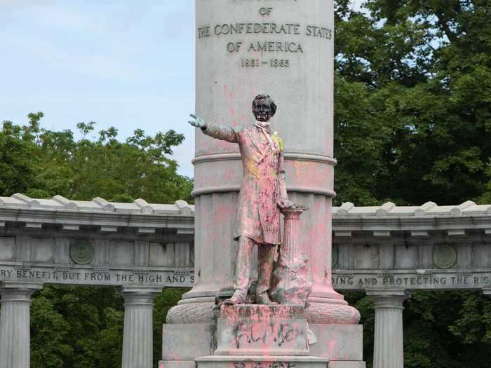 The statue of Confederate president Jefferson Davis was also marked with paint and graffiti before being completely torn down by protesters in Richmond.