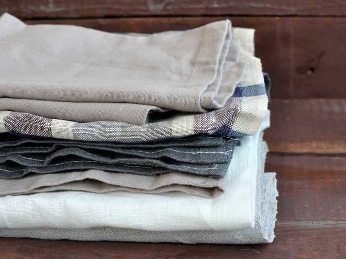 Old or worn dish towels can be repurposed as cleaning rags.