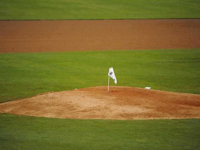 People have planted flags in sporting arenas like at this baseball pitching mound ...