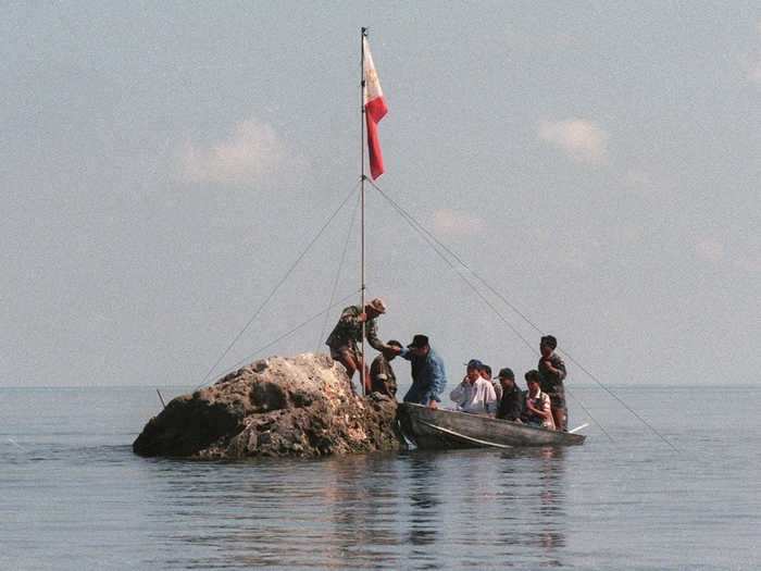 This rock in the middle of the ocean has been claimed by both the Philippines and China.