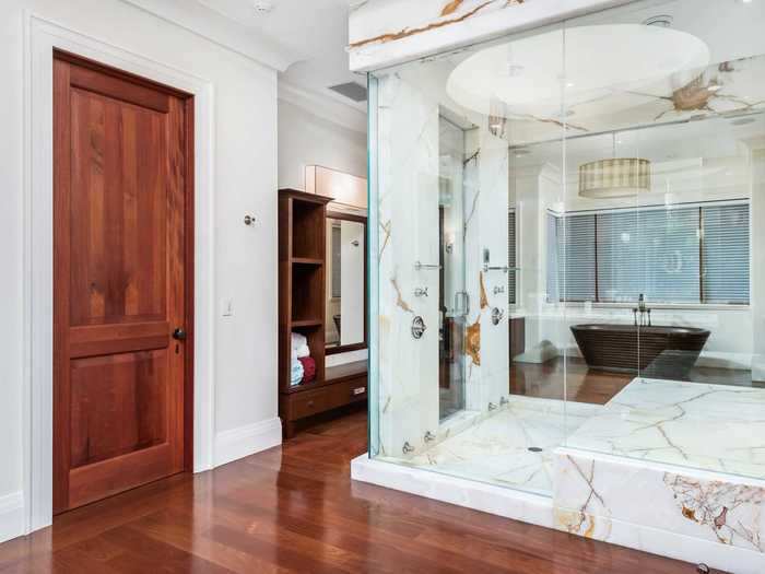 The master bathroom has a walk-in steam shower made of onyx ...