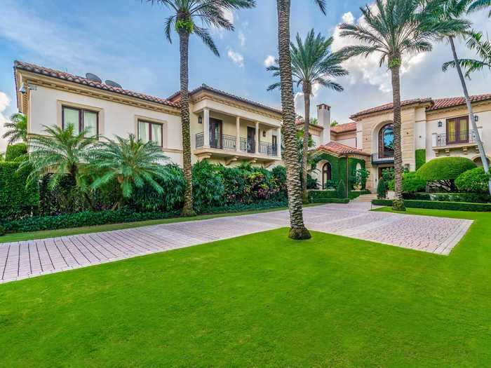 The 10-bedroom, 12-bathroom home spans two stories, has an elevator, and sits on just under an acre of waterfront property.