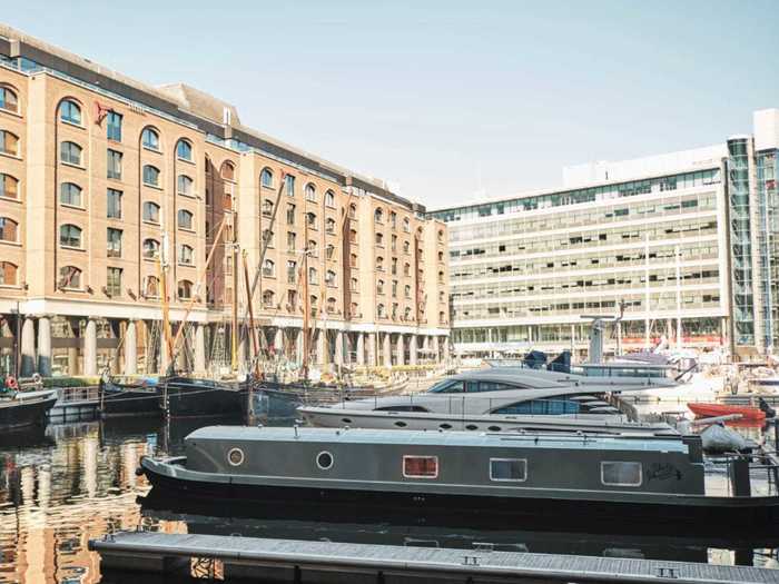 Houseboats come in all shapes and sizes. This wide beam canal boat is also docked in London.