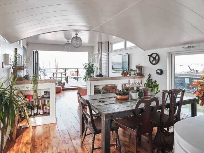 While storms may force houseboat owners to come inside, an open yet cozy space still awaits them.